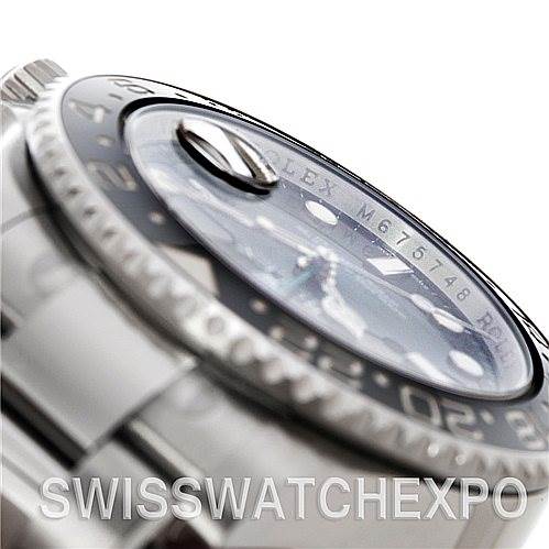 This is a close-up angle of a Rolex GMT-Master 116710 Men's Stainless Steel Black Dial 116710 Men's Stainless Steel Black Dial watch showcasing the bezel, part of the dial, and the bracelet.