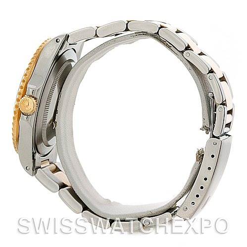 Side view of the Rolex GMT-Master 16713 Men's Stainless Steel Black Dial 16713 Men's Stainless Steel Black Dial watch showing the crown, bezel, bracelet, and clasp.