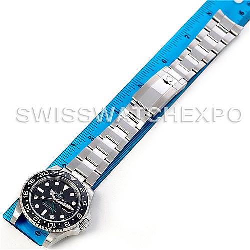 The image shows a top-down view of a Rolex GMT-Master 116710 Men's Stainless Steel Black Dial 116710 Men's Stainless Steel Black Dial watch, focusing on the bracelet and clasp, with a ruler for scale.