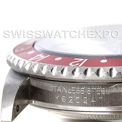 The image shows a side angle of the bezel and part of the case of a Rolex GMT-Master 16710 Men's Stainless Steel Black Dial 16710 Men's Stainless Steel Black Dial watch, with the serial number visible.