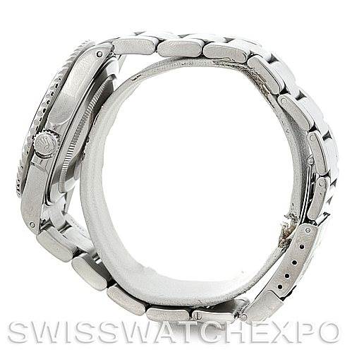 The image shows a side view of a Rolex GMT-Master 16710 Men's Stainless Steel Black Dial 16710 Men's Stainless Steel Black Dial watch, displaying the crown, case, and partially open bracelet.