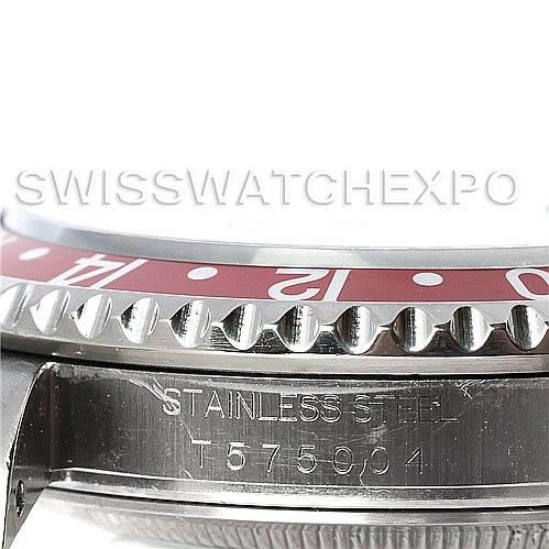 This image shows a close-up of the bezel and the case side, including the serial number, of a Rolex GMT-Master 16710 Men's Stainless Steel Black Dial 16710 Men's Stainless Steel Black Dial watch.