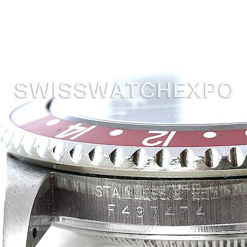 The image shows a close-up side view of the Rolex GMT-Master 16710 Men's Stainless Steel Black Dial 16710 Men's Stainless Steel Black Dial watch, focusing on the bezel, case edge, and serial number engraving.