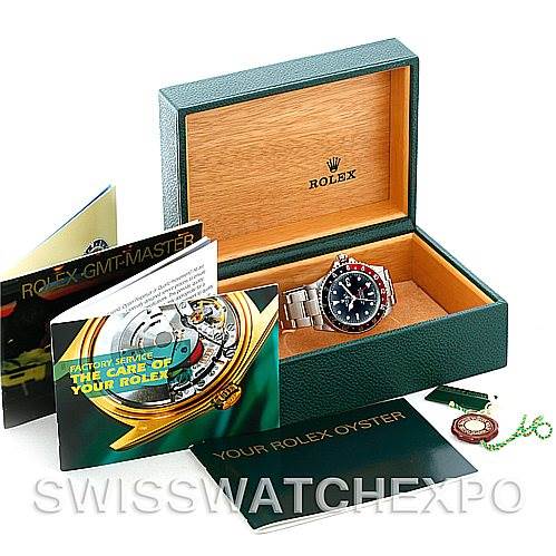 The image showcases the Rolex GMT-Master 16710 Men's Stainless Steel Black Dial 16710 Men's Stainless Steel Black Dial watch, box, brochures, and accessories from a slightly top-side angle.