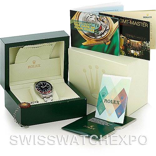 The image shows a Rolex GMT-Master 16710 Men's Stainless Steel Black Dial 16710 Men's Stainless Steel Black Dial watch in its box, along with booklets and packaging materials.