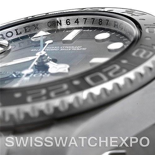 This close-up image of the Rolex GMT-Master 116710 Men's Stainless Steel Black Dial 116710 Men's Stainless Steel Black Dial shows the bezel, part of the dial, and the serial number.