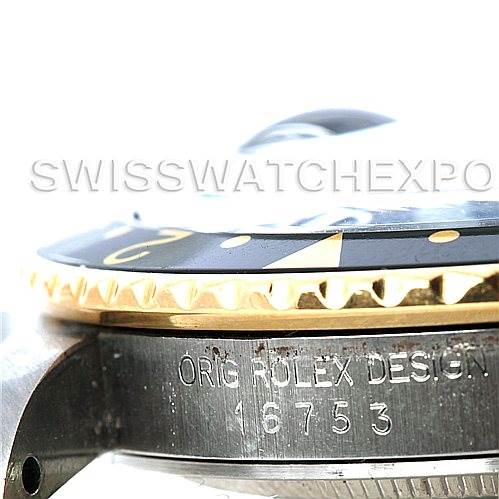 The image shows a close-up side view of the bezel, crystal, and case of a Rolex GMT-Master 16753 Men's Stainless Steel Black Dial 16753 Men's Stainless Steel Black Dial model with the engraving "ORIG ROLEX DESIGN 16753".