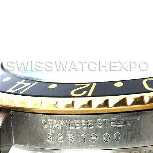 This image shows a close-up of the side of a Rolex GMT-Master 16753 Men's Stainless Steel Black Dial 16753 Men's Stainless Steel Black Dial watch, highlighting the bezel and the "STAINLESS STEEL" engraving.
