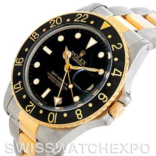 This image shows a Rolex GMT-Master 16753 Men's Stainless Steel Black Dial 16753 Men's Stainless Steel Black Dial watch from an angled view, highlighting its black bezel, dial, and two-tone bracelet.