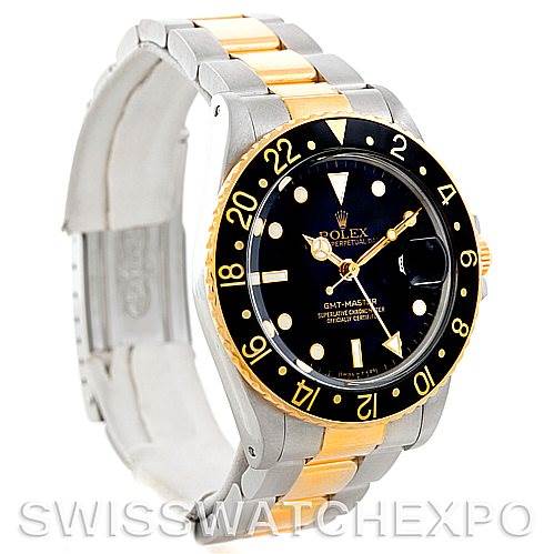 This image shows a Rolex GMT-Master 16753 Men's Stainless Steel Black Dial 16753 Men's Stainless Steel Black Dial watch at a slight angle, highlighting its black dial, gold and silver bracelet, and 24-hour bezel.