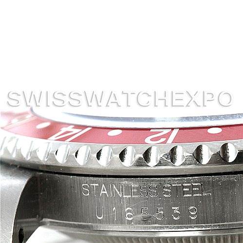 This image shows a close-up side view of the red bezel, stainless steel case, and serial number of a Rolex GMT-Master 16700 Men's Stainless Steel Black Dial 16700 Men's Stainless Steel Black Dial watch.