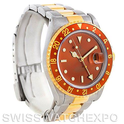 The image shows a Rolex GMT-Master 16713 Men
s Stainless Steel Brown Dial 16713 Men
s Stainless Steel Brown Dial watch from the front angle, highlighting its two-tone bracelet, red bezel, and brown dial.