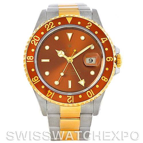 The Rolex GMT-Master 16713 Men
s Stainless Steel Brown Dial 16713 Men
s Stainless Steel Brown Dial watch is shown from the front, displaying the face, bezel, date window, and part of the two-tone bracelet.