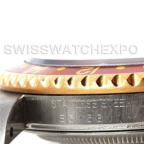 The image shows a close-up side view of the bezel and case side of a Rolex GMT-Master 16713 Men
s Stainless Steel Brown Dial 16713 Men
s Stainless Steel Brown Dial watch, highlighting the "STAINLESS STEEL" engraving.