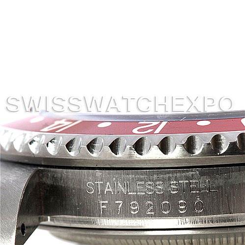 This image shows a close-up side-angle of the Rolex GMT-Master 16710 Men's Stainless Steel Black Dial 16710 Men's Stainless Steel Black Dial watch bezel and an engraving on the stainless steel case.
