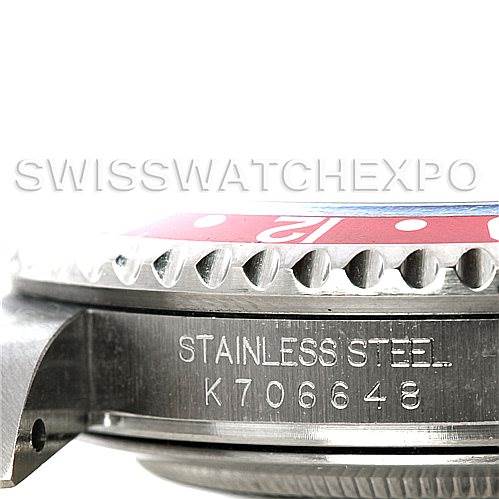 This image shows a close-up side view of a Rolex GMT-Master 16710 Men's Stainless Steel Black Dial 16710 Men's Stainless Steel Black Dial watch, featuring the bezel, engraving, and part of the case.