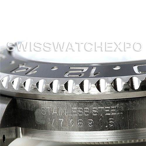 The image shows a close-up of the side view of the bezel and stainless steel case of a Rolex GMT-Master 116710 Men's Stainless Steel Black Dial 116710 Men's Stainless Steel Black Dial watch.