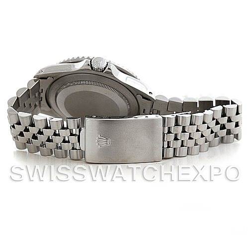 The image shows the back angle of a Rolex GMT-Master 16700 Men's Stainless Steel Black Dial 16700 Men's Stainless Steel Black Dial watch, highlighting the stainless steel case back and Jubilee bracelet with clasp.