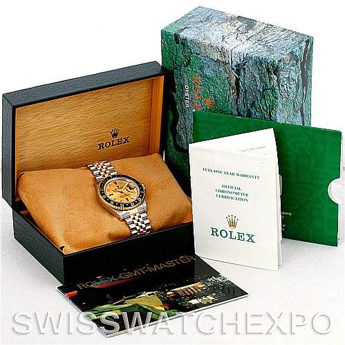 The image shows a Rolex GMT-Master 16713 Men's Stainless Steel Champagne Dial 16713 Men's Stainless Steel Champagne Dial watch in its box, along with warranty cards and booklets, from a slightly angled top-down view.