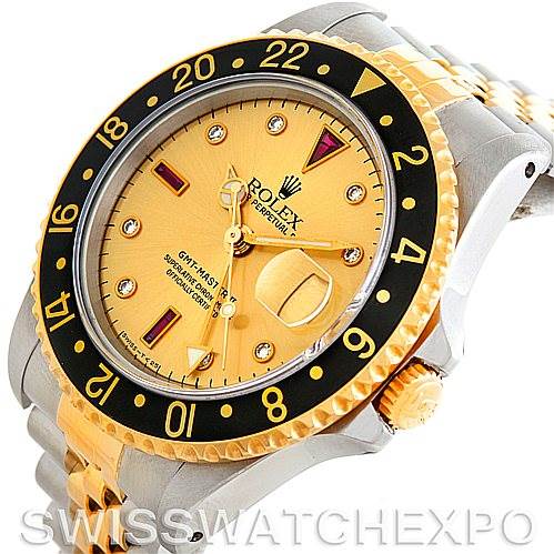 The image shows a Rolex GMT-Master 16713 Men's Stainless Steel Champagne Dial 16713 Men's Stainless Steel Champagne Dial with a gold dial, bezel, crown, and part of the two-tone bracelet from an angled side view.