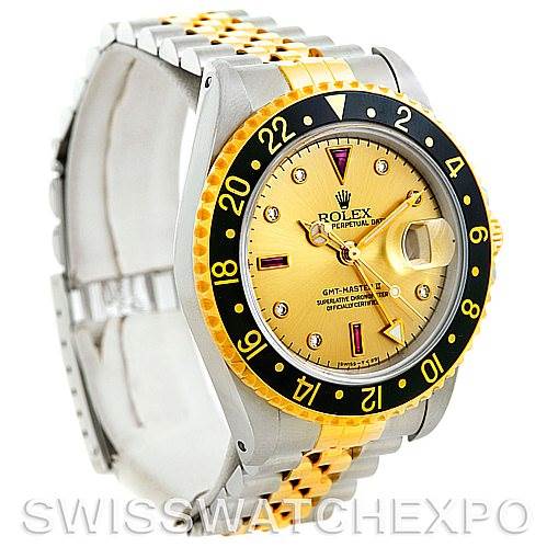 This image shows a Rolex GMT-Master 16713 Men's Stainless Steel Champagne Dial 16713 Men's Stainless Steel Champagne Dial watch at a three-quarter angle, highlighting its gold bezel, dial, two-tone bracelet, and cyclops lens.