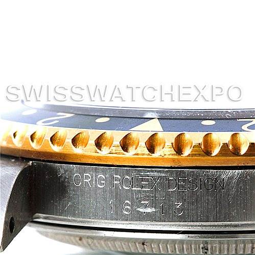 This close-up angle of the Rolex GMT-Master 16713 Men's Stainless Steel Champagne Dial 16713 Men's Stainless Steel Champagne Dial watch shows the watch case side and bezel with its markings.