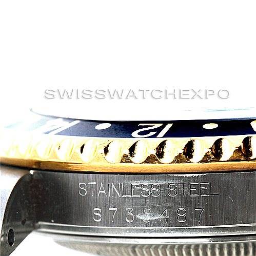 The image shows a close-up of the side of a Rolex GMT-Master 16713 Men's Stainless Steel Black Dial 16713 Men's Stainless Steel Black Dial watch, highlighting the stainless steel case with engraved serial number and partial bezel.