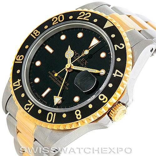 This image shows a close-up view of the face and part of the bracelet of the Rolex GMT-Master 16713 Men's Stainless Steel Black Dial 16713 Men's Stainless Steel Black Dial watch.