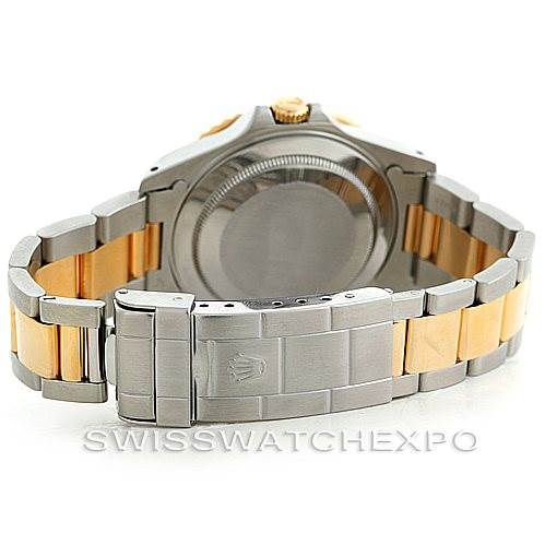 This image of a Rolex GMT-Master 16713 Men's Stainless Steel Black Dial 16713 Men's Stainless Steel Black Dial watch shows the case back and the bracelet, highlighting its two-tone metal design.