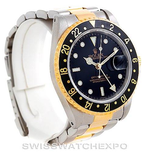 This image shows a side angle of the Rolex GMT-Master 16713 Men's Stainless Steel Black Dial 16713 Men's Stainless Steel Black Dial II watch, highlighting the bezel, dial, and two-tone bracelet.