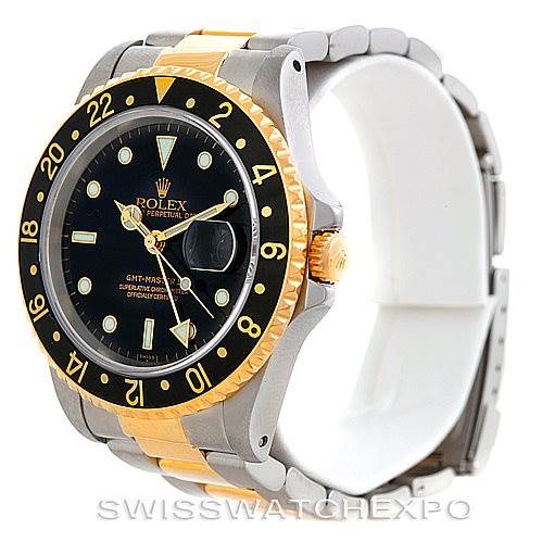 The Rolex GMT-Master 16713 Men's Stainless Steel Black Dial 16713 Men's Stainless Steel Black Dial watch is shown at a 3/4 angle, highlighting its black dial, gold bezel, and two-tone metal strap.
