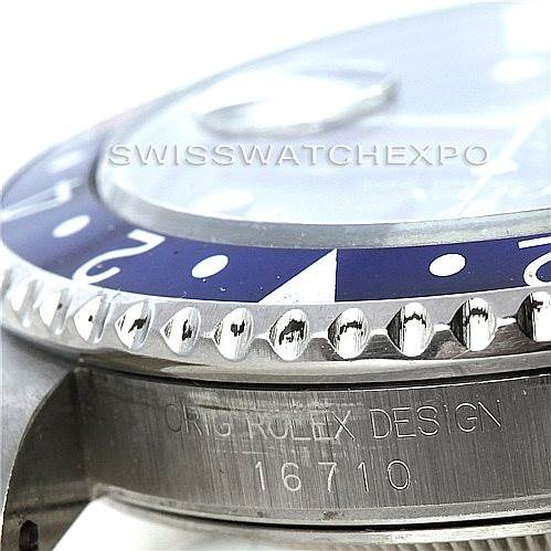 This image shows a close-up of the bezel, part of the dial, and the case with the engraved model number 16710 of the Rolex GMT-Master 16710 Men's Stainless Steel Black Dial 16710 Men's Stainless Steel Black Dial watch.