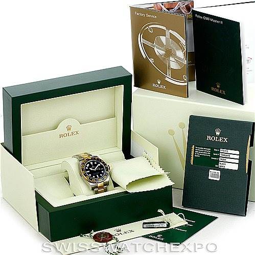 This image shows a Rolex GMT-Master 116713 Men's Stainless Steel Black Dial 116713 Men's Stainless Steel Black Dial watch from a front angle inside its box, along with manuals, tags, and an additional box.
