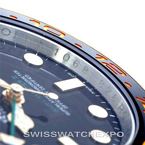 The image shows a close-up of the bezel and part of the dial of a Rolex GMT-Master 116713 Men's Stainless Steel Black Dial 116713 Men's Stainless Steel Black Dial watch, highlighting the numerals and markers.