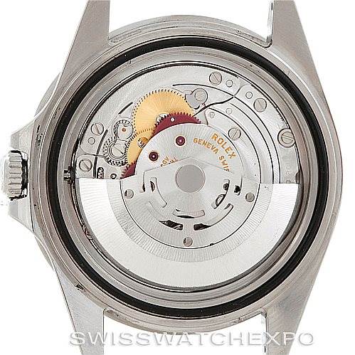 The image shows the back view of a Rolex GMT-Master 16710 Men's Stainless Steel Black Dial 16710 Men's Stainless Steel Black Dial watch, revealing its internal movement and intricate mechanical parts.