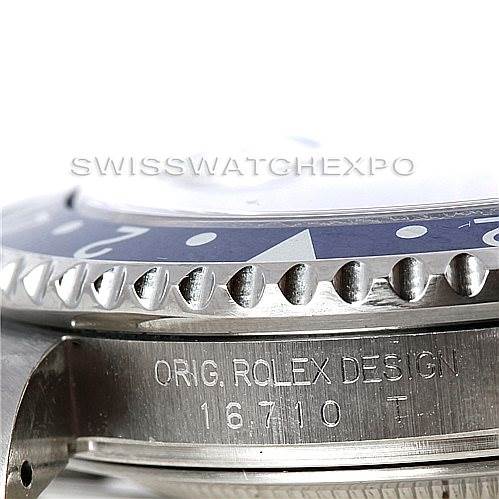 The image shows a side view of the bezel and engraved case of a Rolex GMT-Master 16710 Men's Stainless Steel Black Dial 16710 Men's Stainless Steel Black Dial with the engraving "ORIG. ROLEX DESIGN 16710 T."