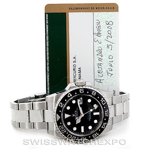 The image shows a Rolex GMT-Master 116710 Men's Stainless Steel Black Dial 116710 Men's Stainless Steel Black Dial watch with its bracelet and warranty card displayed in the background.