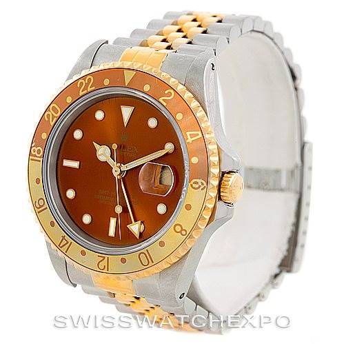 This image shows a Rolex GMT-Master 16713 Men's Stainless Steel Brown Dial 16713 Men's Stainless Steel Brown Dial watch at an angle highlighting the two-tone bracelet, brown dial, and brown and gold bezel.
