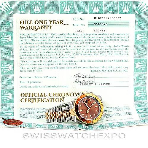 The Rolex GMT-Master 16713 Men's Stainless Steel Brown Dial 16713 Men's Stainless Steel Brown Dial watch is shown at a slight angle with its face, bezel, and partial bracelet visible, accompanied by warranty documentation.