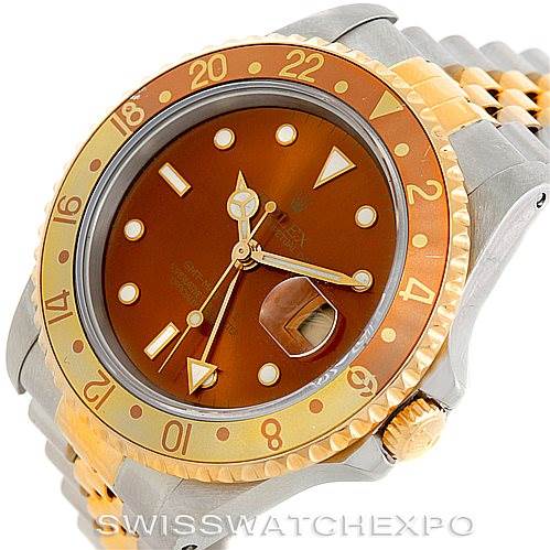 The image shows an angled view of a Rolex GMT-Master 16713 Men's Stainless Steel Brown Dial 16713 Men's Stainless Steel Brown Dial watch, highlighting the dial, bezel, crown, and part of the bracelet.