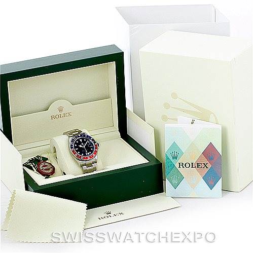 The image shows a Rolex GMT-Master 16710 Men's Stainless Steel Black Dial 16710 Men's Stainless Steel Black Dial watch with its box, warranty card, and various accessories from a top-down angle.