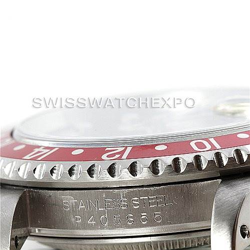 This image shows the side angle of a Rolex GMT-Master 16710 Men's Stainless Steel Black Dial 16710 Men's Stainless Steel Black Dial watch, highlighting the bezel and case with "STAINLESS STEEL" and a serial number engraved.