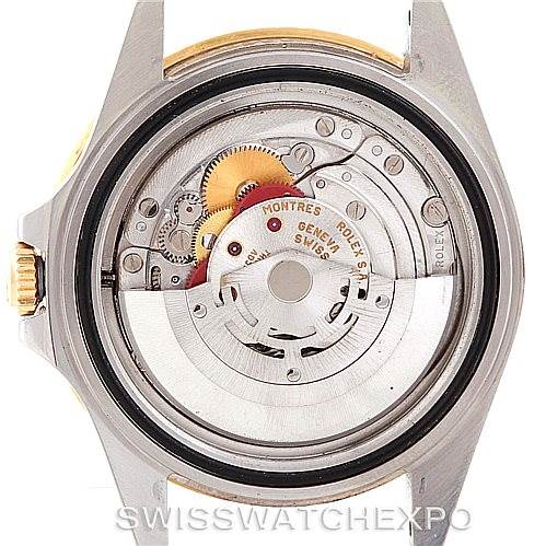 This image shows a Rolex GMT-Master 16713 Men's Stainless Steel Champagne Dial 16713 Men's Stainless Steel Champagne Dial watch from a straight-on angle, highlighting its internal movement and components.