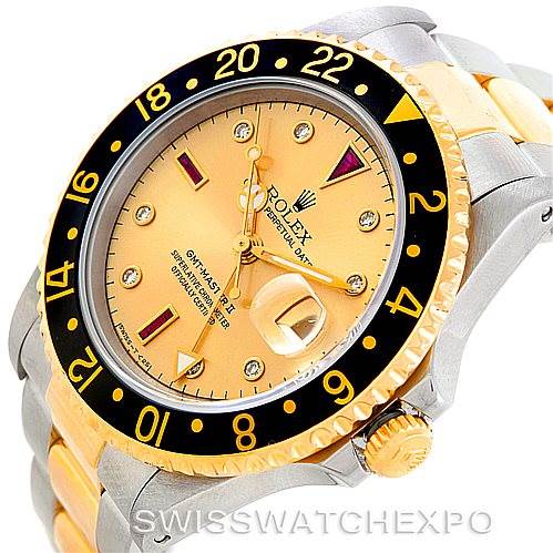 This image shows a Rolex GMT-Master 16713 Men's Stainless Steel Champagne Dial 16713 Men's Stainless Steel Champagne Dial wristwatch at an angled view highlighting the bezel, dial, crown, and part of the bracelet.