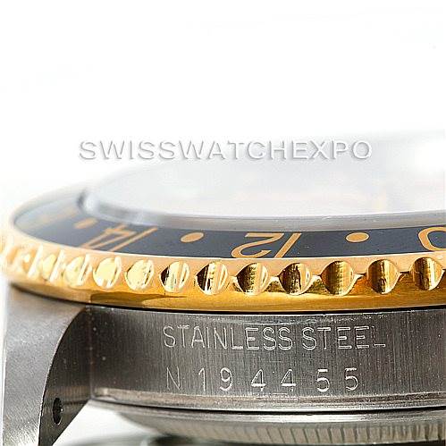 This image shows a close-up side view of the casing and bezel of a Rolex GMT-Master 16713 Men's Stainless Steel Champagne Dial 16713 Men's Stainless Steel Champagne Dial watch, highlighting the stainless steel and serial number.