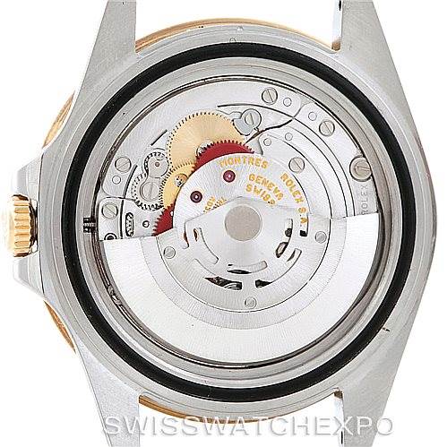 This image shows the back view of a Rolex GMT-Master 16713 Men
s Stainless Steel Brown Dial 16713 Men
s Stainless Steel Brown Dial, highlighting its intricate movement mechanism.