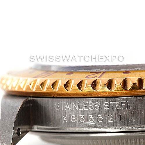 This close-up angle shows the bezel, case, and part of the bracelet of the Rolex GMT-Master 16713 Men
s Stainless Steel Brown Dial 16713 Men
s Stainless Steel Brown Dial watch, focusing on the "STAINLESS STEEL" engraving.