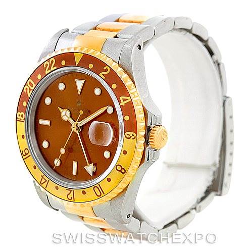 This image shows a side angle of a Rolex GMT-Master 16713 Men
s Stainless Steel Brown Dial 16713 Men
s Stainless Steel Brown Dial watch, highlighting its bezel, crown, and partial bracelet.