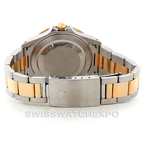 The image shows the back and bracelet clasp of a Rolex GMT-Master 16713 Men
s Stainless Steel Brown Dial 16713 Men
s Stainless Steel Brown Dial watch, with a two-tone design.