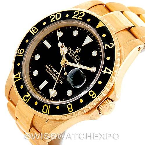This image shows a Rolex GMT-Master 16758 Men's Stainless Steel Black Dial 16758 Men's Stainless Steel Black Dial watch at an angle highlighting the dial, bezel, case, crown, and part of the bracelet.